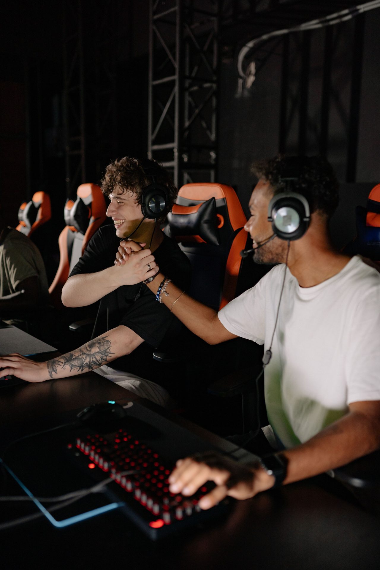 Players huddled at dim Hideout stations, screens glowing low